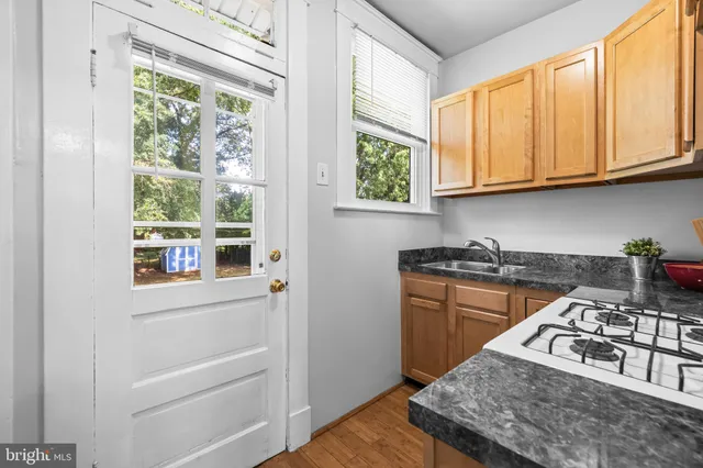 a kitchen with stainless steel appliances granite countertop a stove and a refrigerator