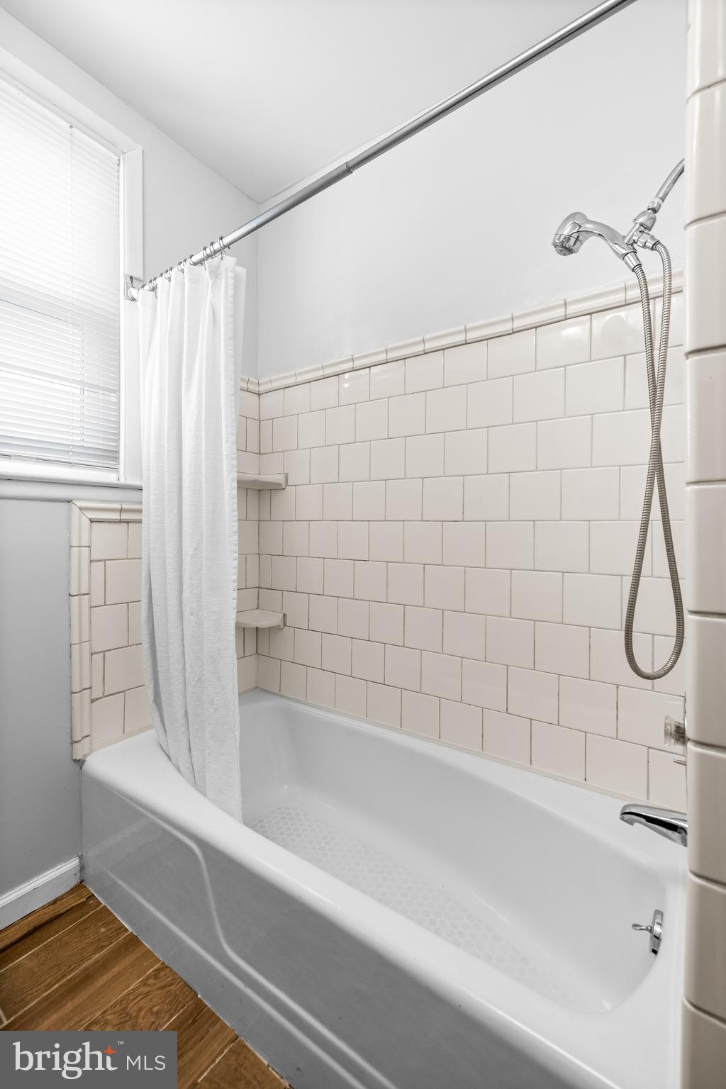 4406 Mainfield Avenue Baltimore, MD 21214 - Photo 25 of 47 a bathroom with a bathtub and a shower