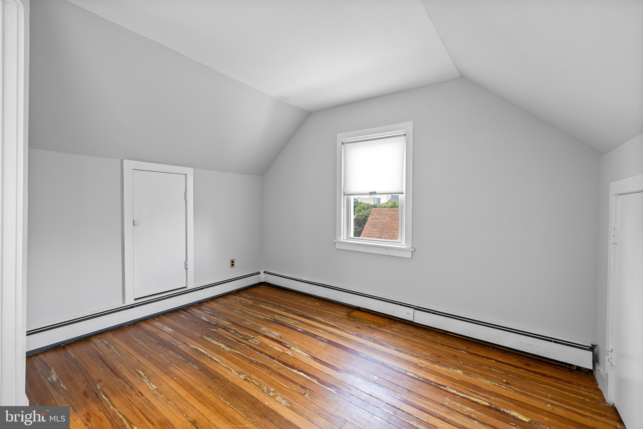4406 Mainfield Avenue Baltimore, MD 21214 - Photo 29 of 47 a view of a room with wooden floor and white walls