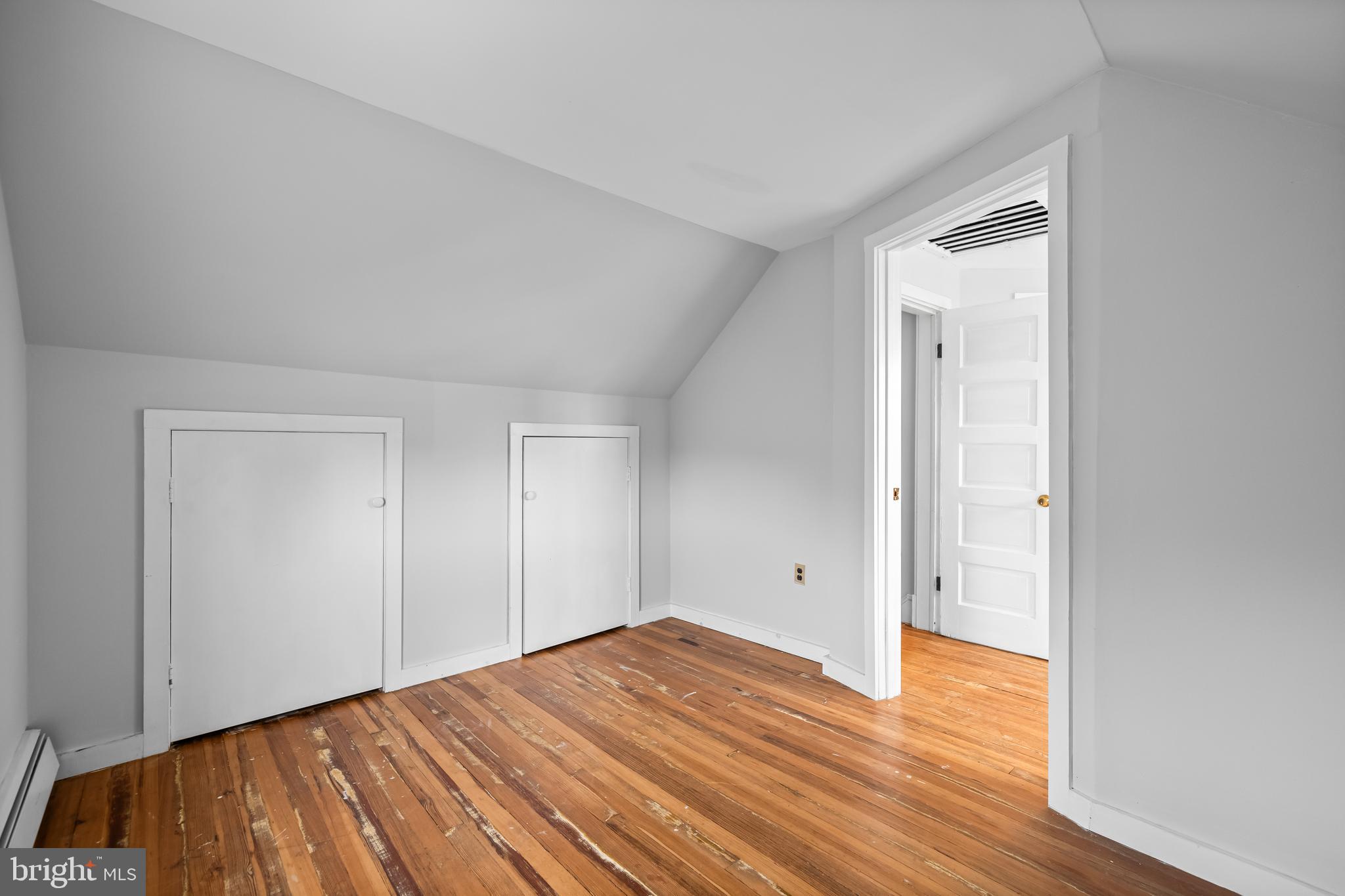 4406 Mainfield Avenue Baltimore, MD 21214 - Photo 30 of 47 a view of empty room with wooden floor