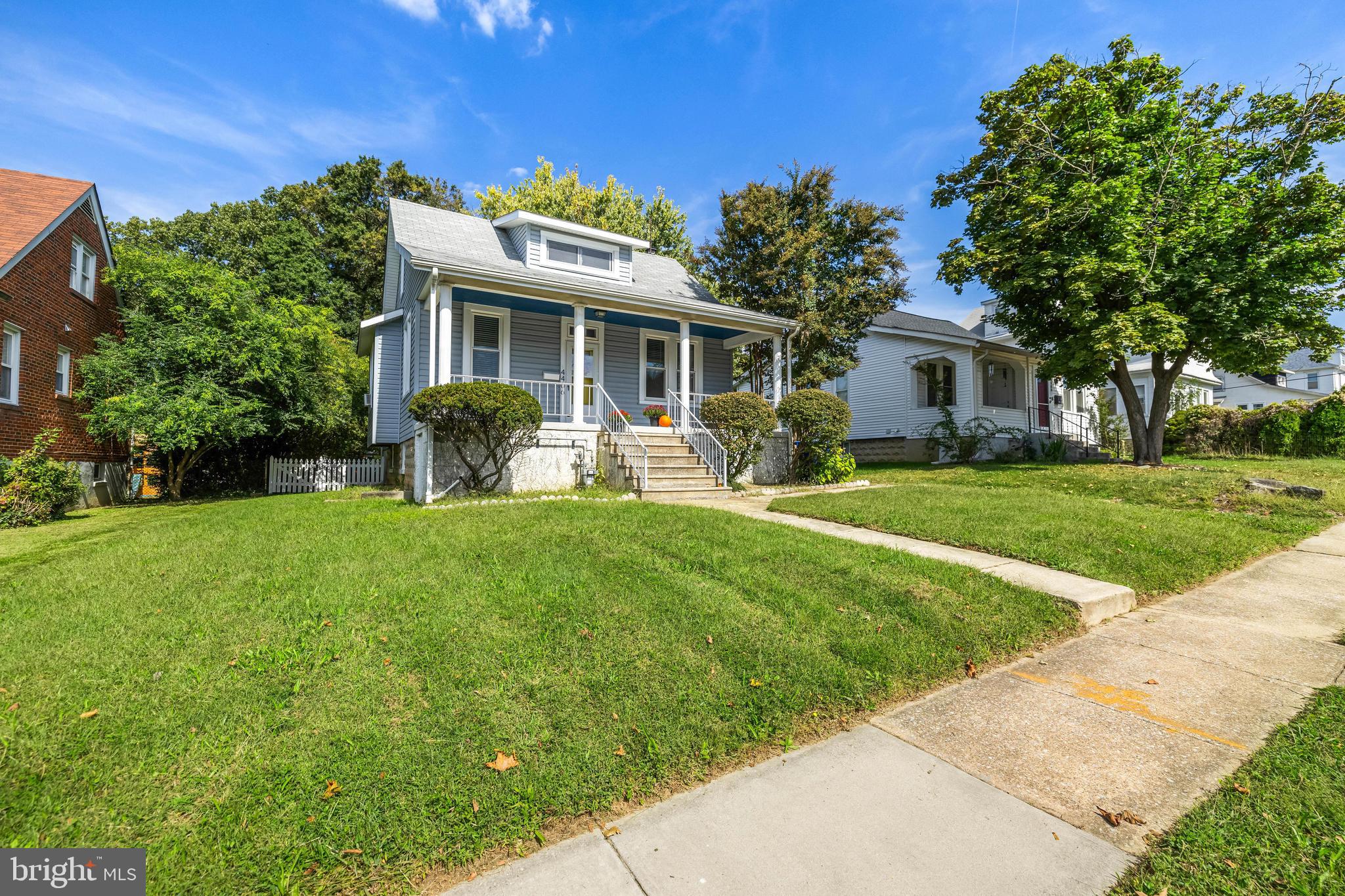 4406 Mainfield Avenue Baltimore, MD 21214 - Photo 42 of 47 a front view of house with yard and green space