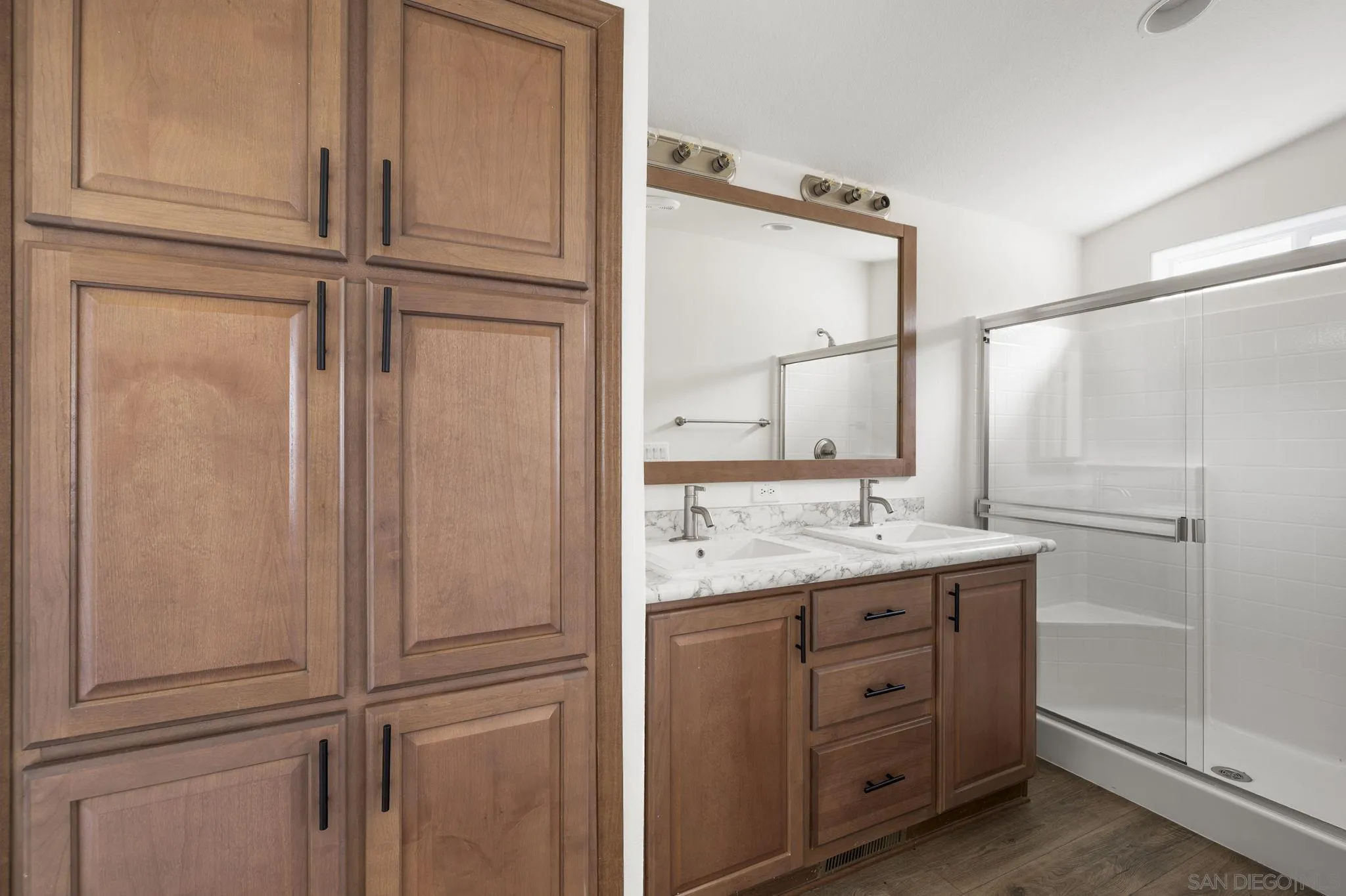 22899 Byron Road, Unit 11 Crestline, CA 92325 - Photo 12 of 25 a bathroom with a granite countertop sink and a mirror