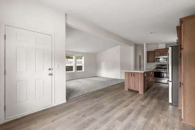 a view of kitchen with furniture and wooden floor