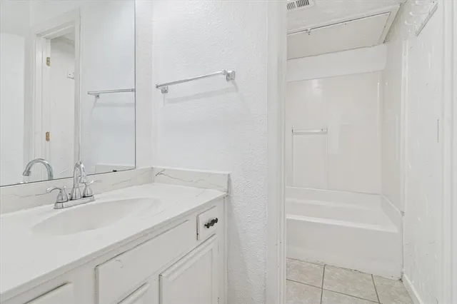 a bathroom with a sink and a bathtub