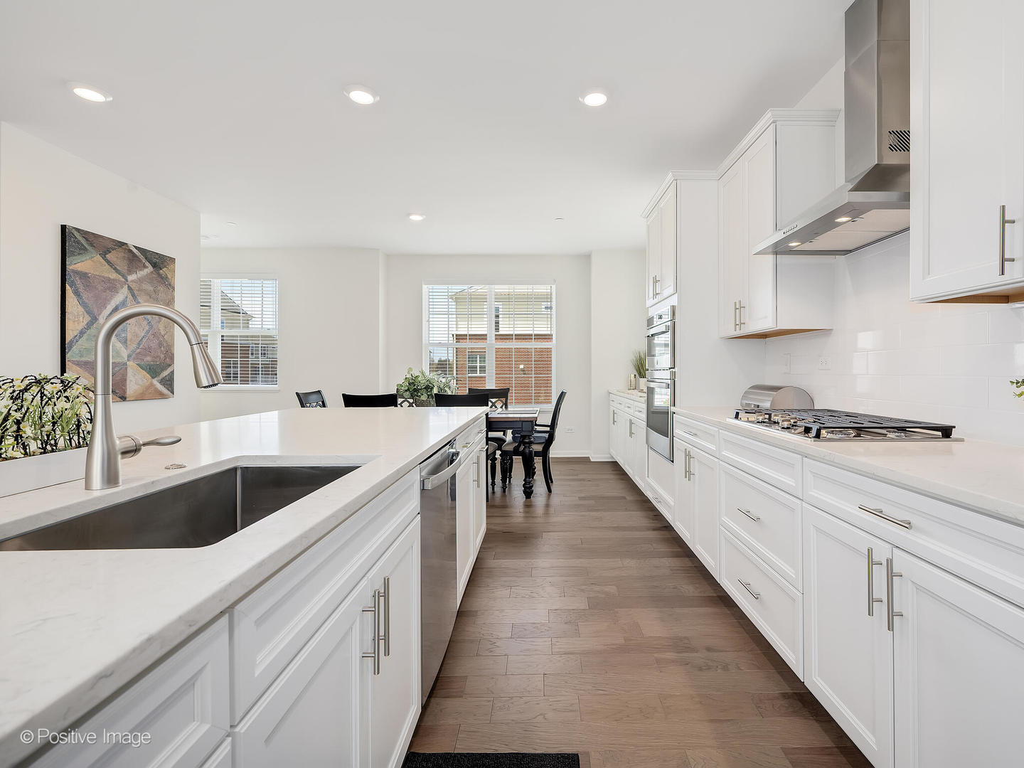 2950 Reflection Drive Naperville, IL 60564 - Photo 18 of 32 a kitchen with white cabinets appliances and a sink