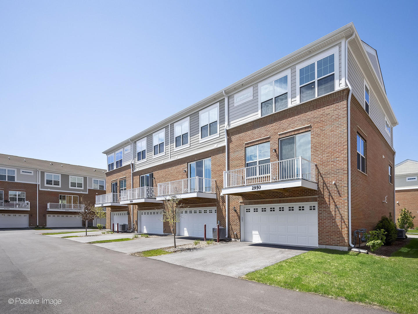 2950 Reflection Drive Naperville, IL 60564 - Photo 28 of 32 a front view of a building with a garden and trees