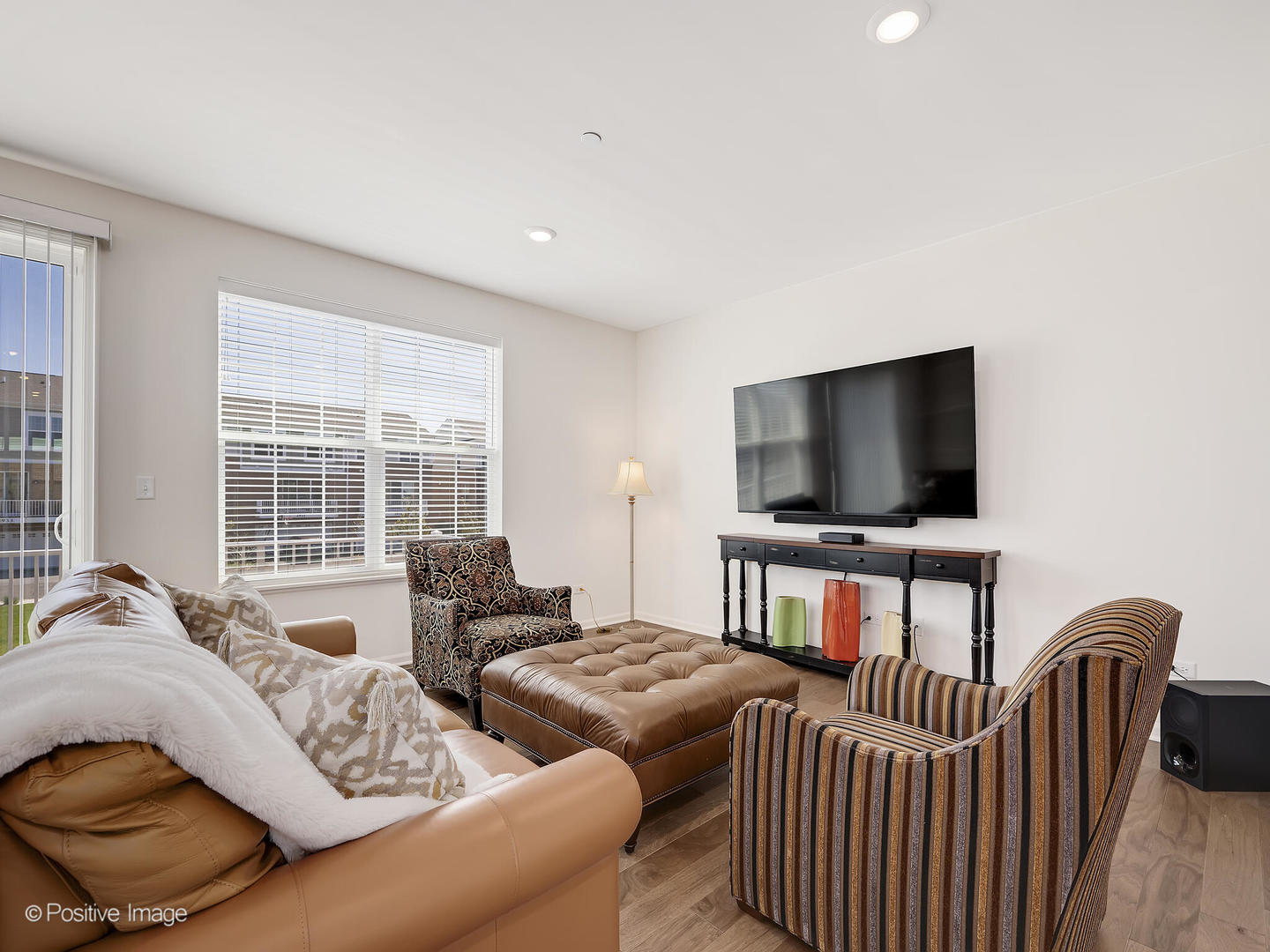 2950 Reflection Drive Naperville, IL 60564 - Photo 8 of 32 a living room with furniture and a flat screen tv