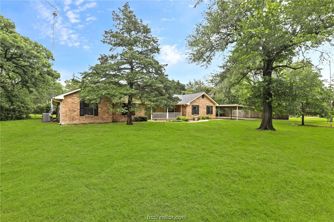 245 Rustic Oaks Drive Bryan, TX 77808 - Photo 1 of 1 a view of a house with a yard