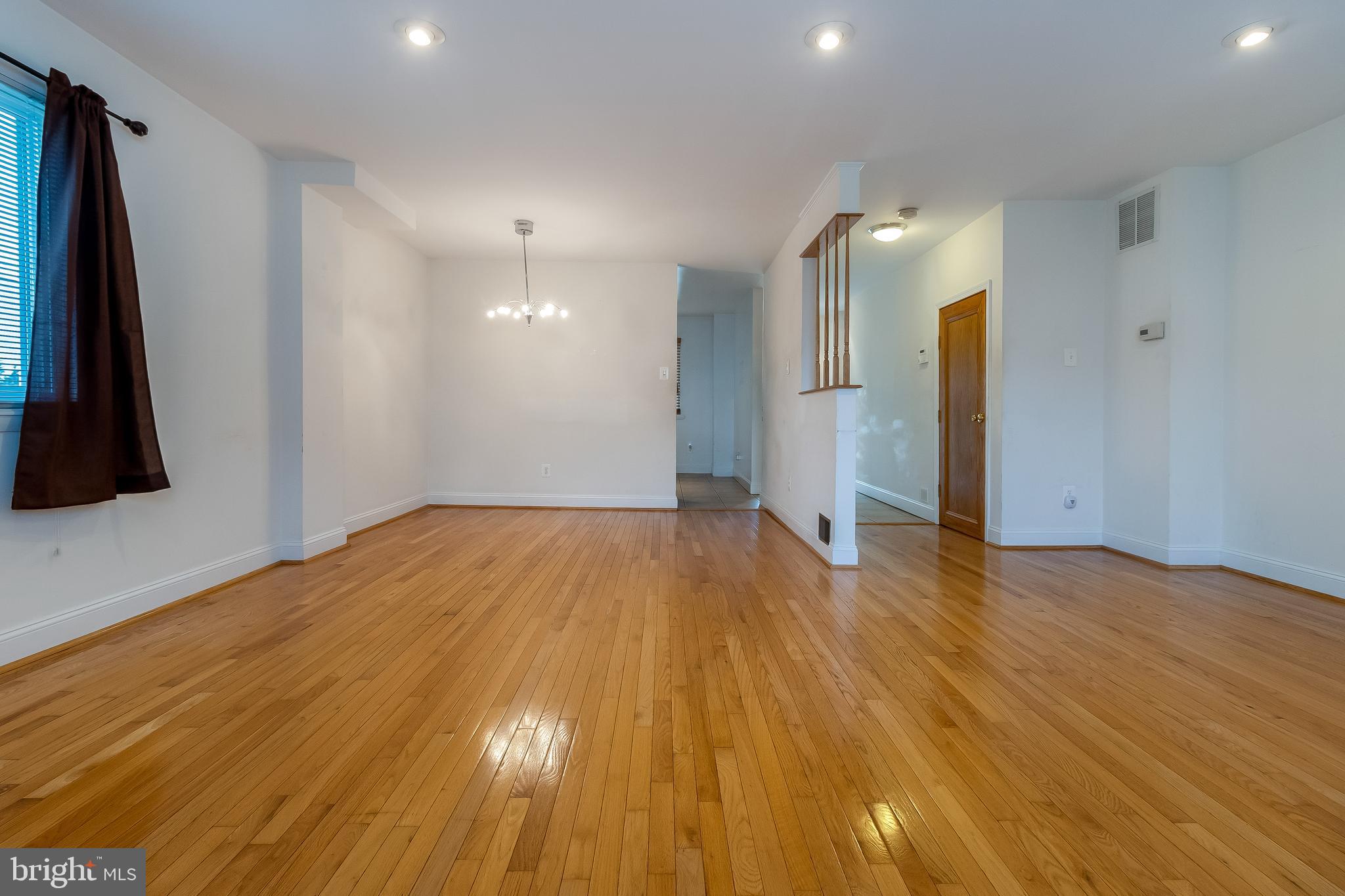 4709 Sargent Road Northeast Washington, DC 20017 - Photo 11 of 28 living room view shows paneled door to basement