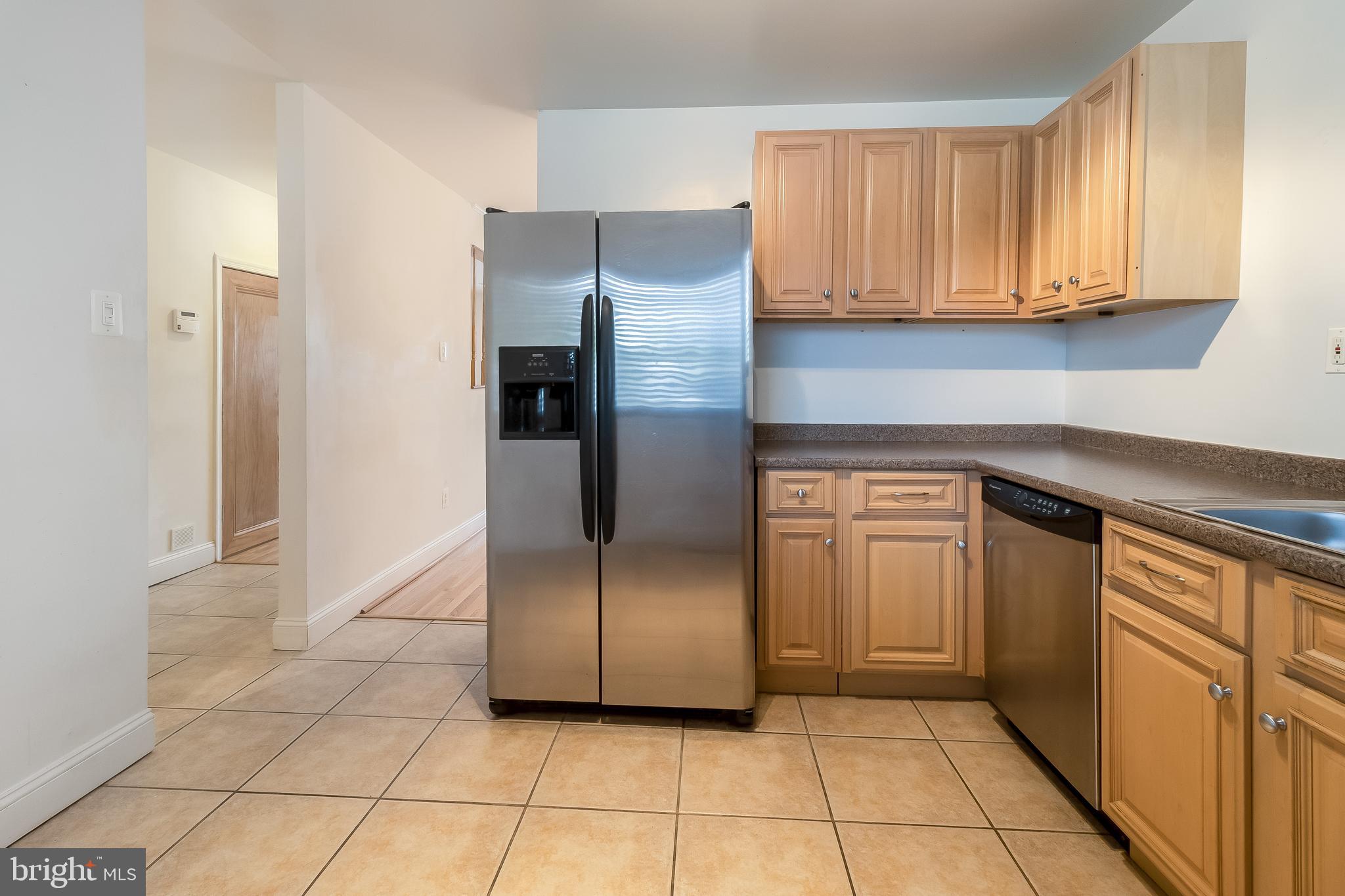 4709 Sargent Road Northeast Washington, DC 20017 - Photo 6 of 28 oak cabinetry and stainless steel appliances