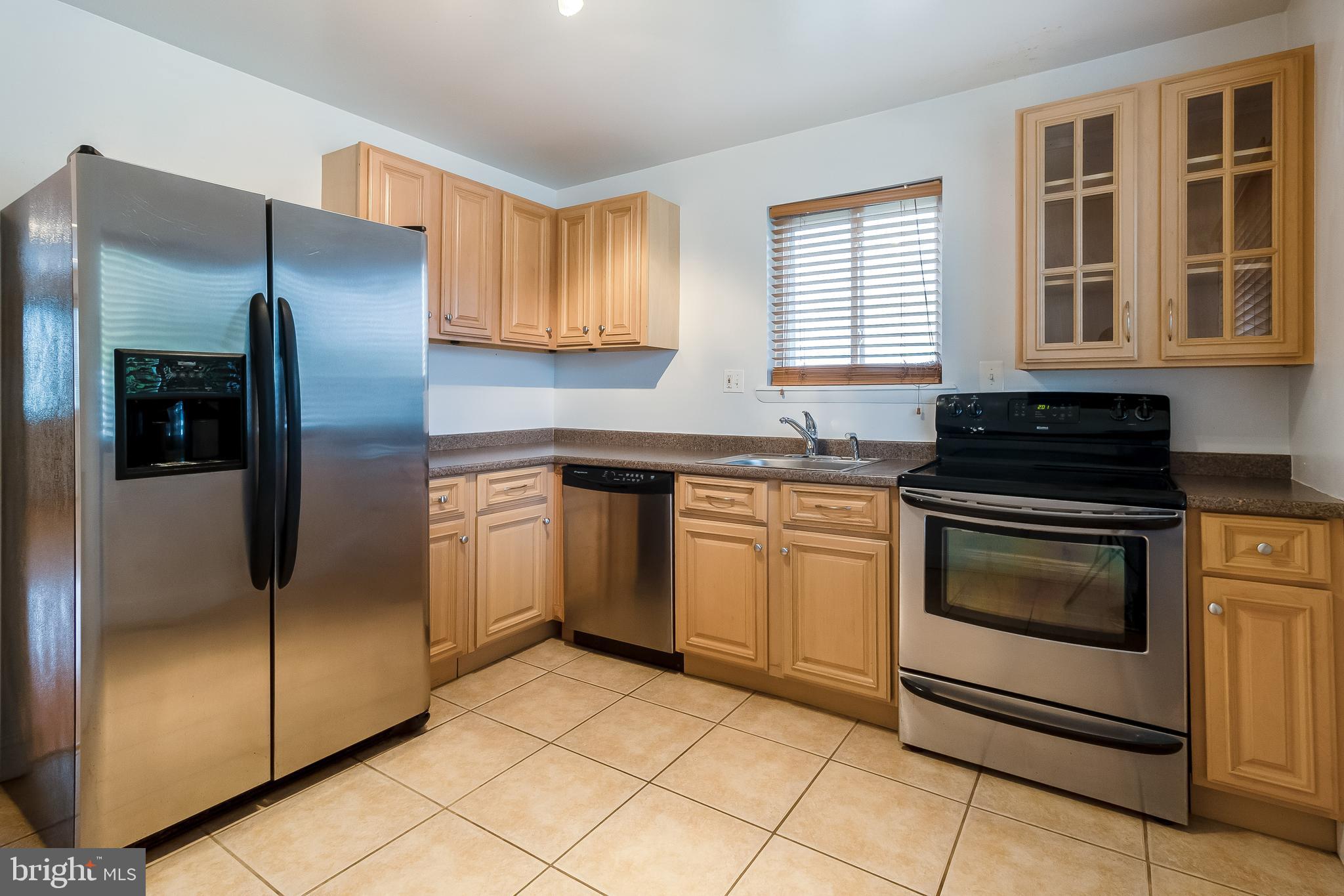 4709 Sargent Road Northeast Washington, DC 20017 - Photo 8 of 28 view of kitchen w/glass-door cabinet