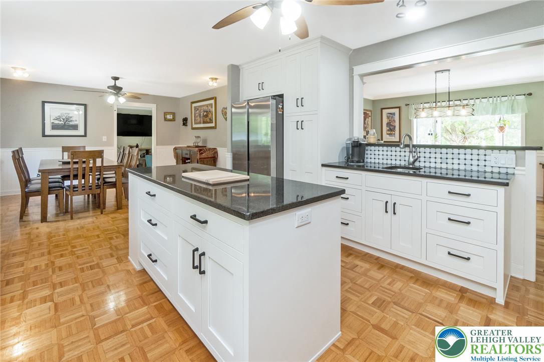 1553 Surrey Road Bethlehem, PA 18015 - Photo 8 of 92 A well-lit kitchen with a spacious island flows seamlessly into the dining area.