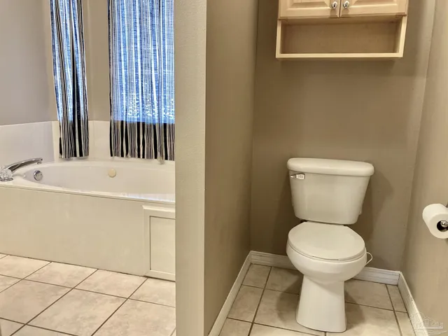 a bathroom with a toilet and a sink