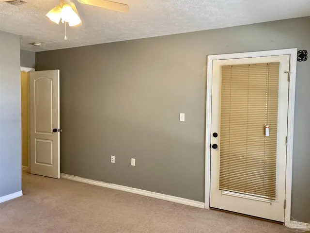 an empty room with closet area