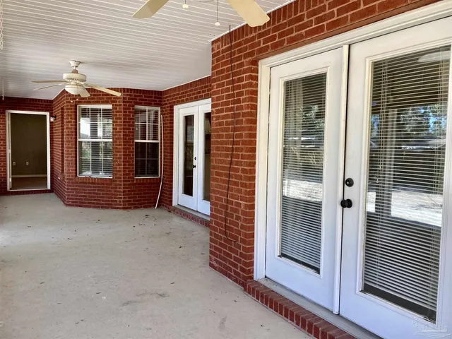 a view of a house with a door and wooden floor