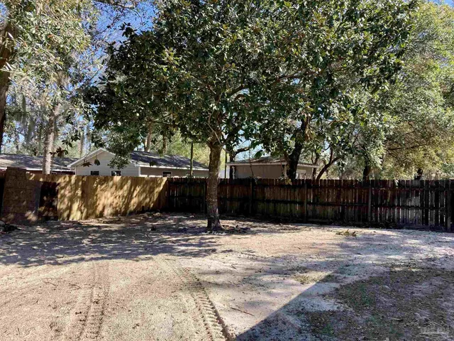a view of a backyard of the house