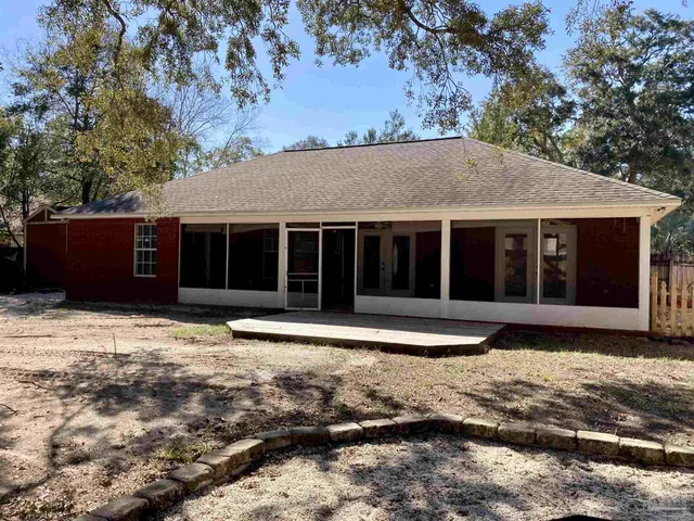 a house with trees in the background