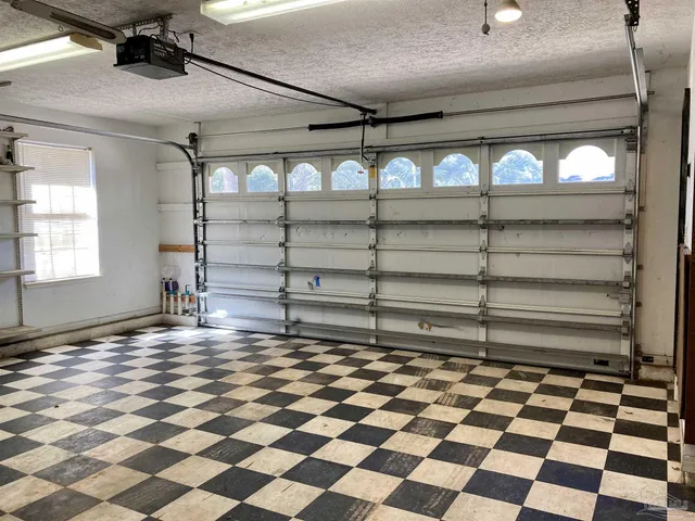 a room with a black white checkered floor