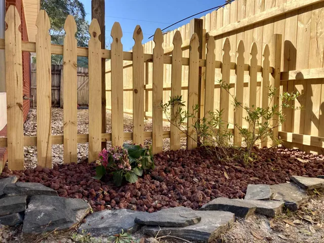 a view of a yard with trees