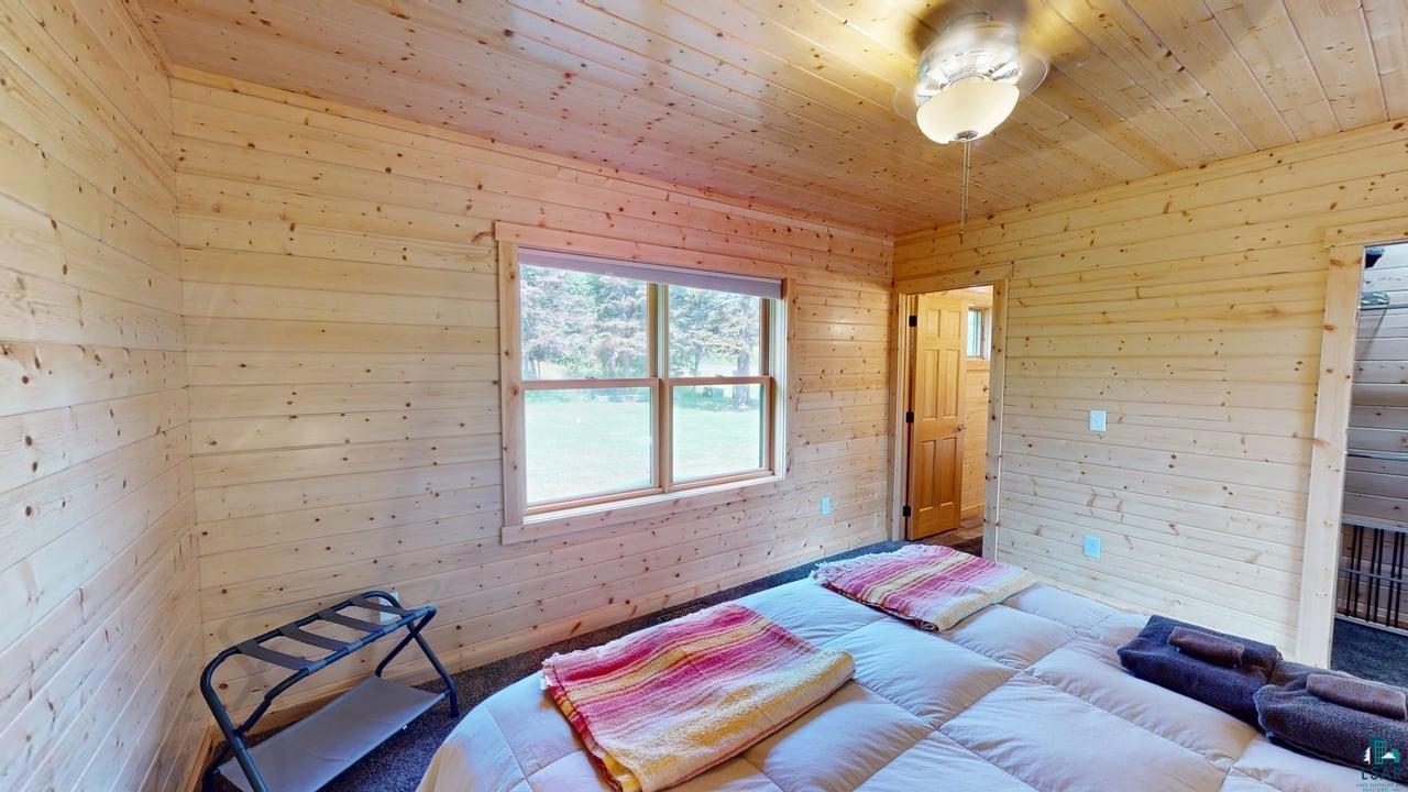 121 Ski Hill Road Lutsen, MN 55612 - Photo 24 of 47 Main Level Primary Bedroom
