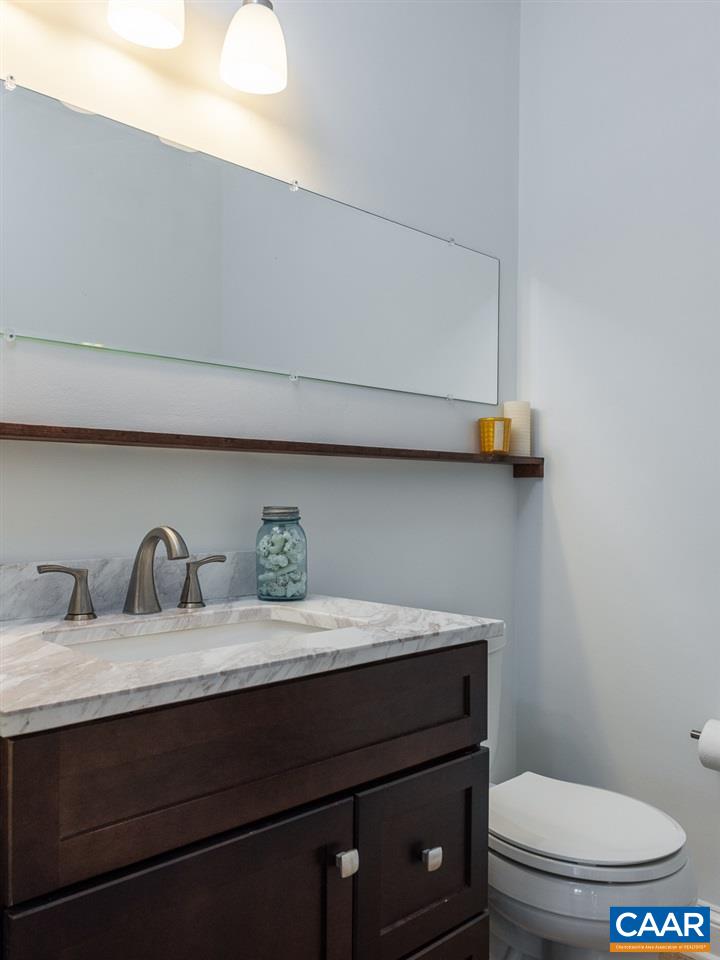 2500 South Bennington Road Charlottesville, VA 22901 - Photo 11 of 33 a bathroom with a toilet a sink and mirror