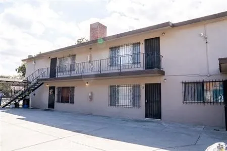 a front view of a house with a garage