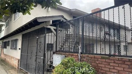 a view of a wooden door with a tree
