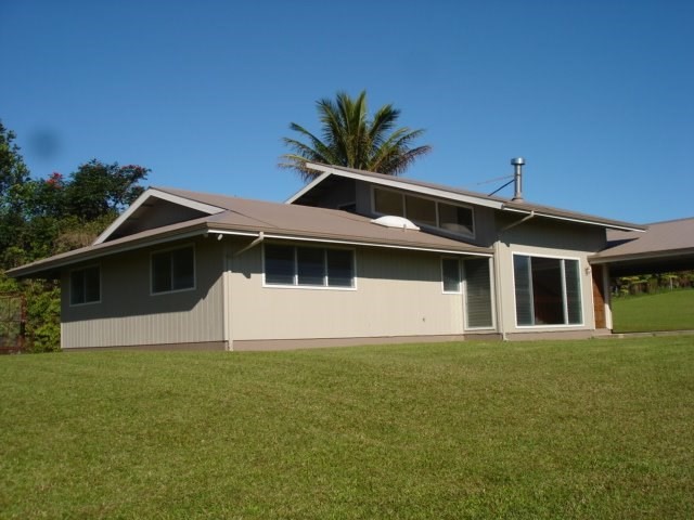 2215 Kaiwiki Road Hilo, HI 96720 - Photo 1 of 30 a front view of a house with a garden