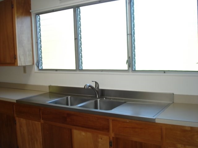 2215 Kaiwiki Road Hilo, HI 96720 - Photo 15 of 30 a kitchen with a sink and a window