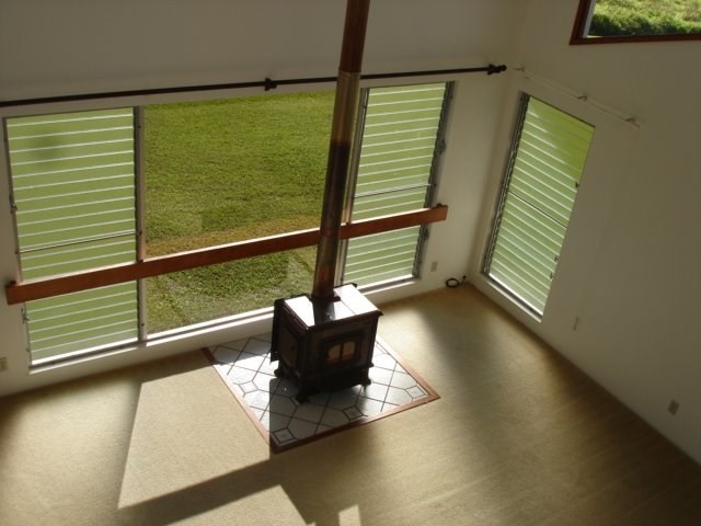 2215 Kaiwiki Road Hilo, HI 96720 - Photo 27 of 30 a view of an empty room with wooden floor and a window
