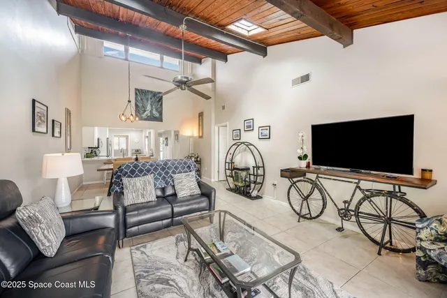 a view of a livingroom with furniture and a flat screen tv