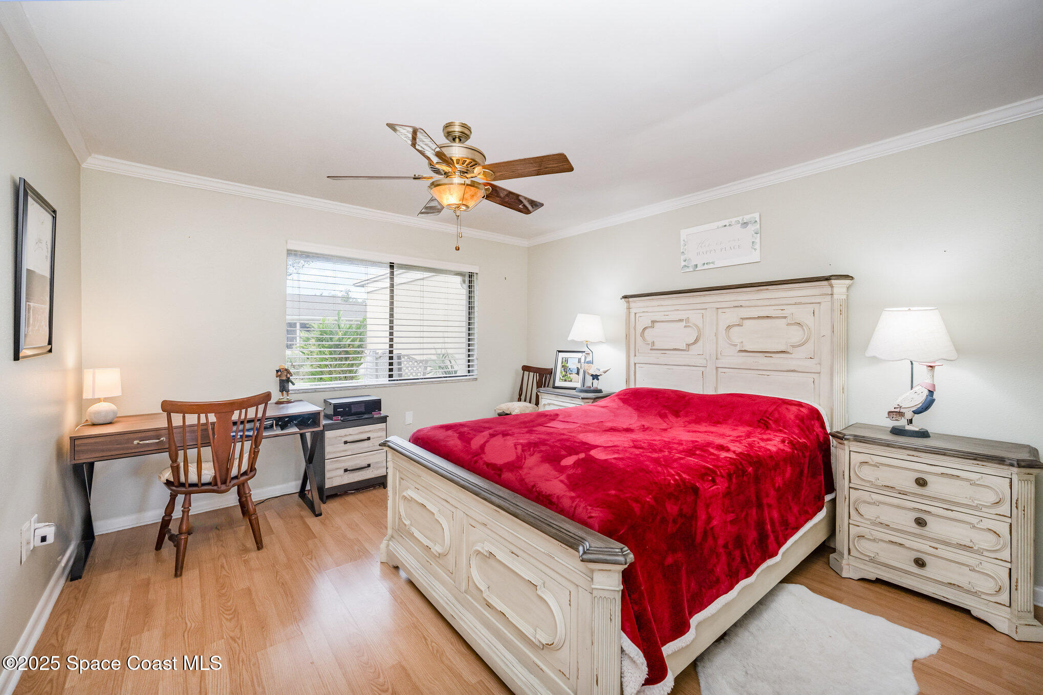 197 Augusta Way Melbourne, FL 32940 - Photo 20 of 37 a bed room with a bed and a table