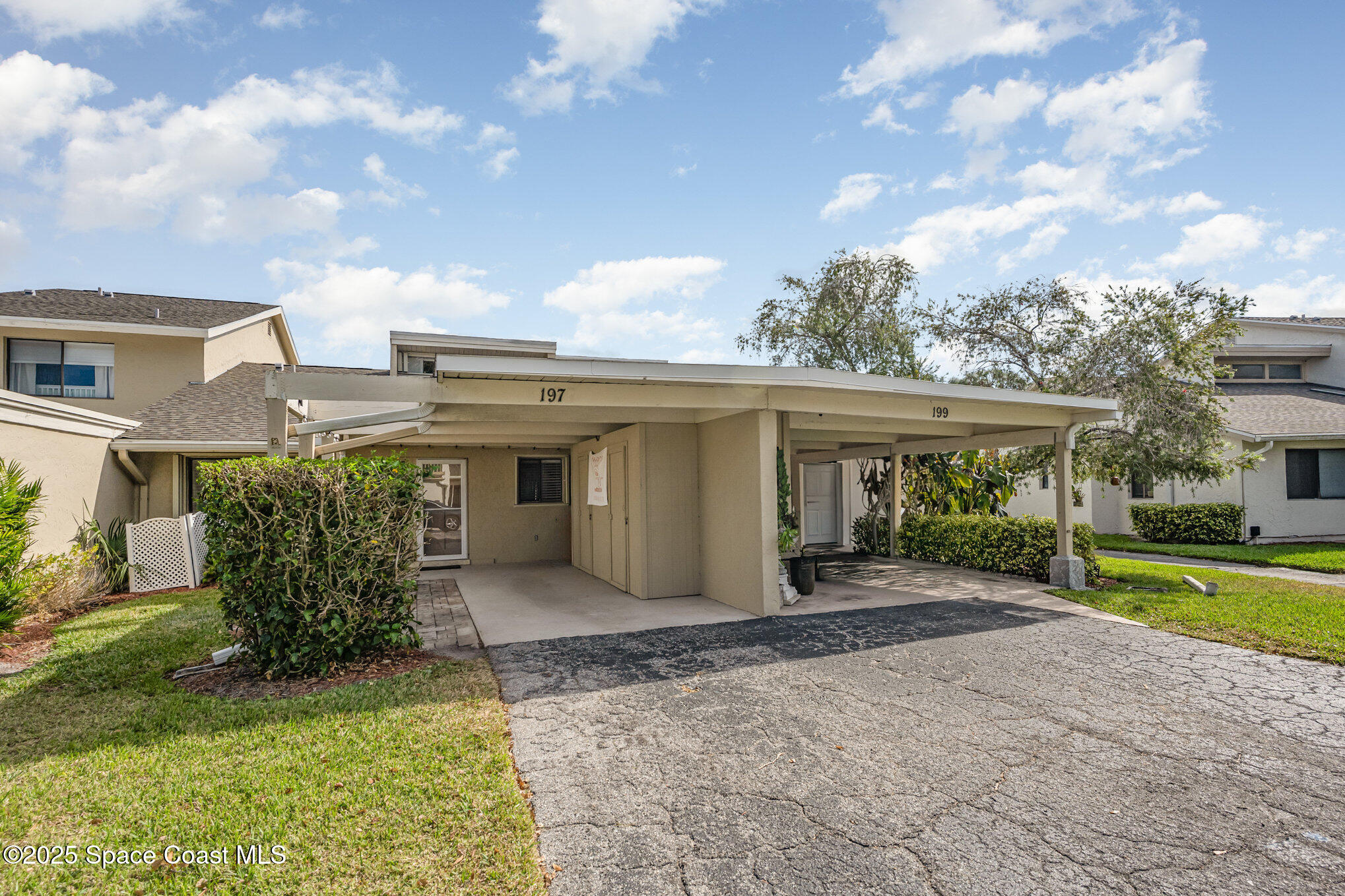197 Augusta Way Melbourne, FL 32940 - Photo 2 of 37 a view of a house with a yard and plants