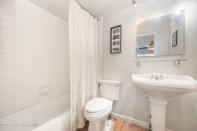 a bathroom with a sink toilet and a bathtub
