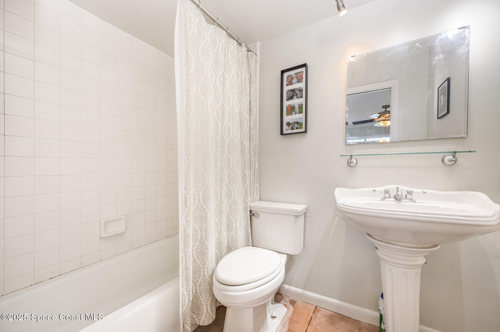 197 Augusta Way Melbourne, FL 32940 - Photo 21 of 37 a bathroom with a sink toilet and a bathtub