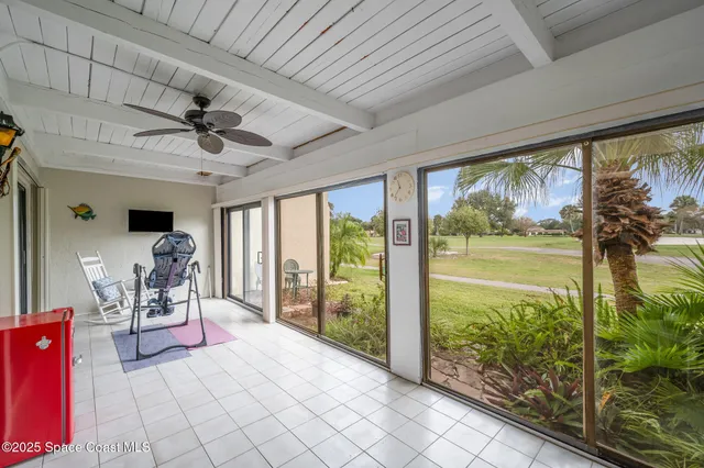a very nice looking room with a large window and chandelier