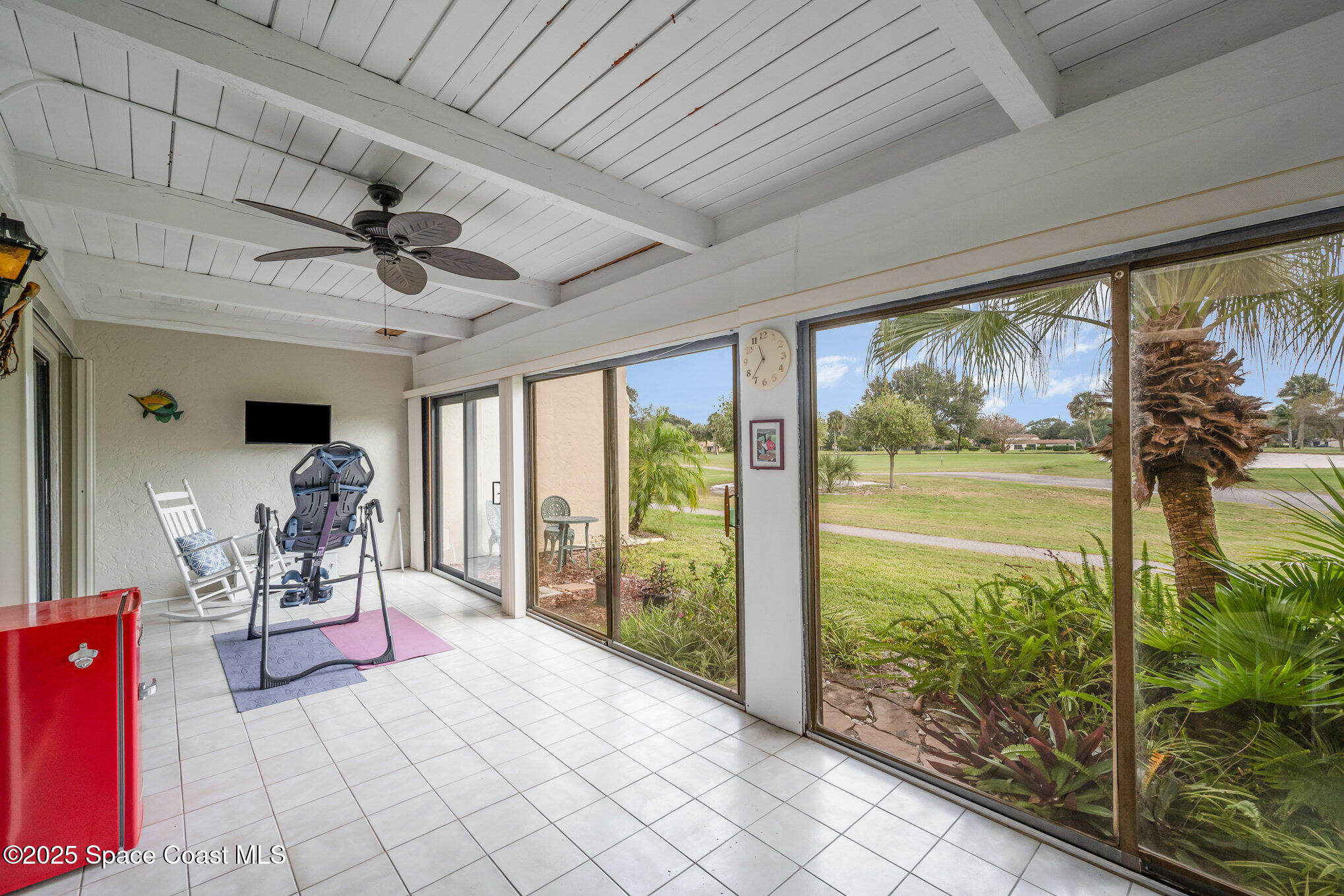 197 Augusta Way Melbourne, FL 32940 - Photo 23 of 37 a very nice looking room with a large window and chandelier