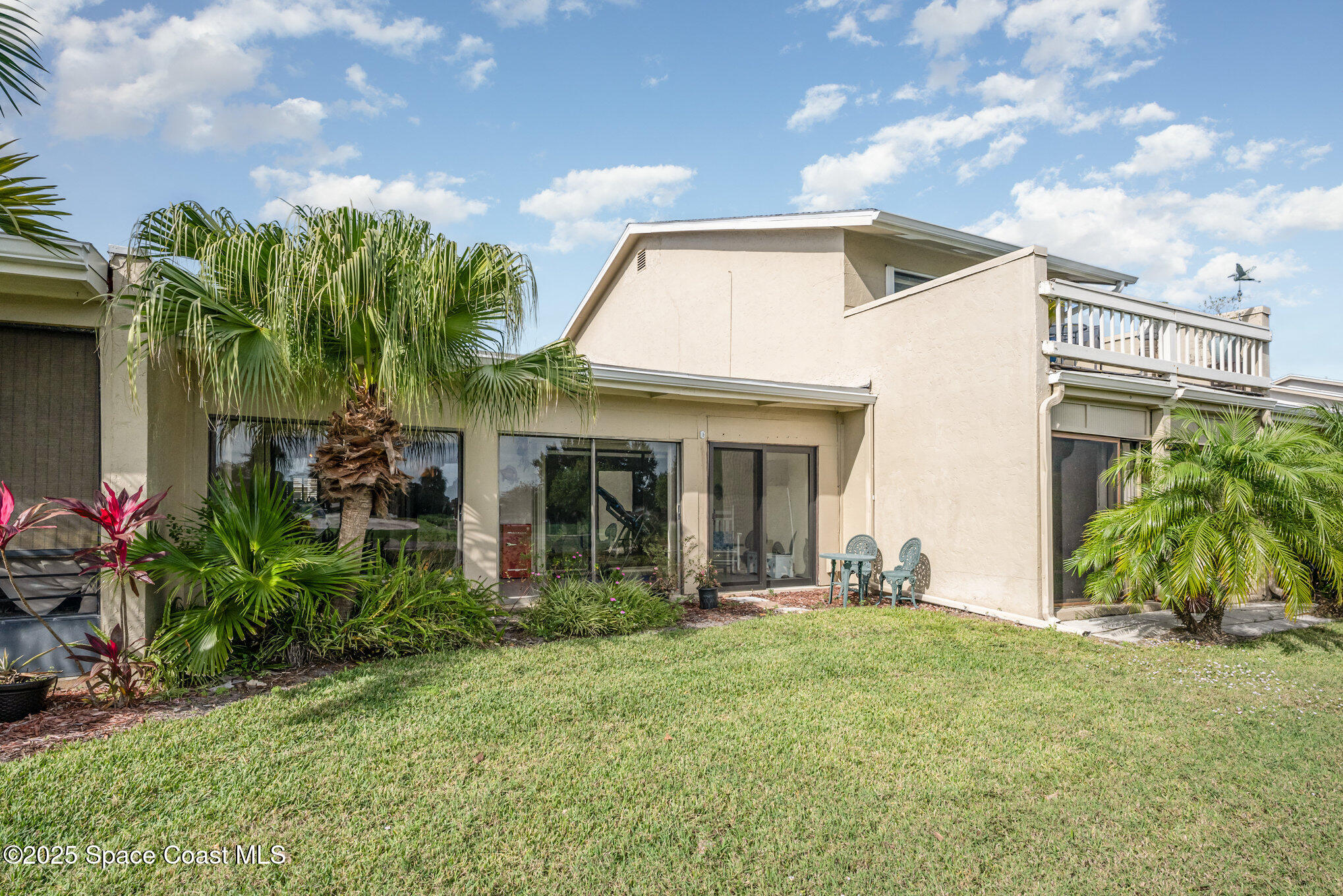 197 Augusta Way Melbourne, FL 32940 - Photo 26 of 37 a front view of house with yard