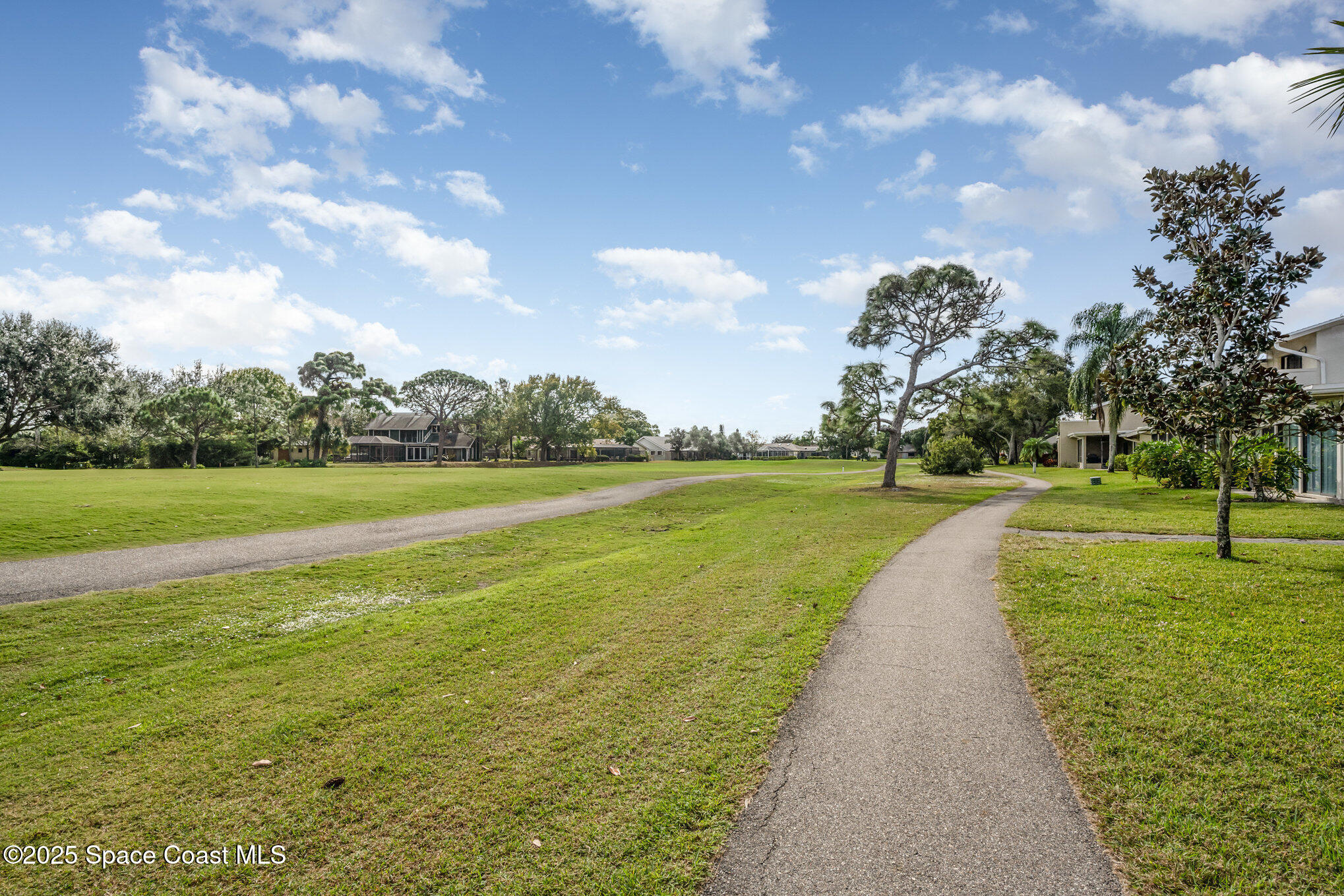 197 Augusta Way Melbourne, FL 32940 - Photo 30 of 37 a view of a lake with a big yard