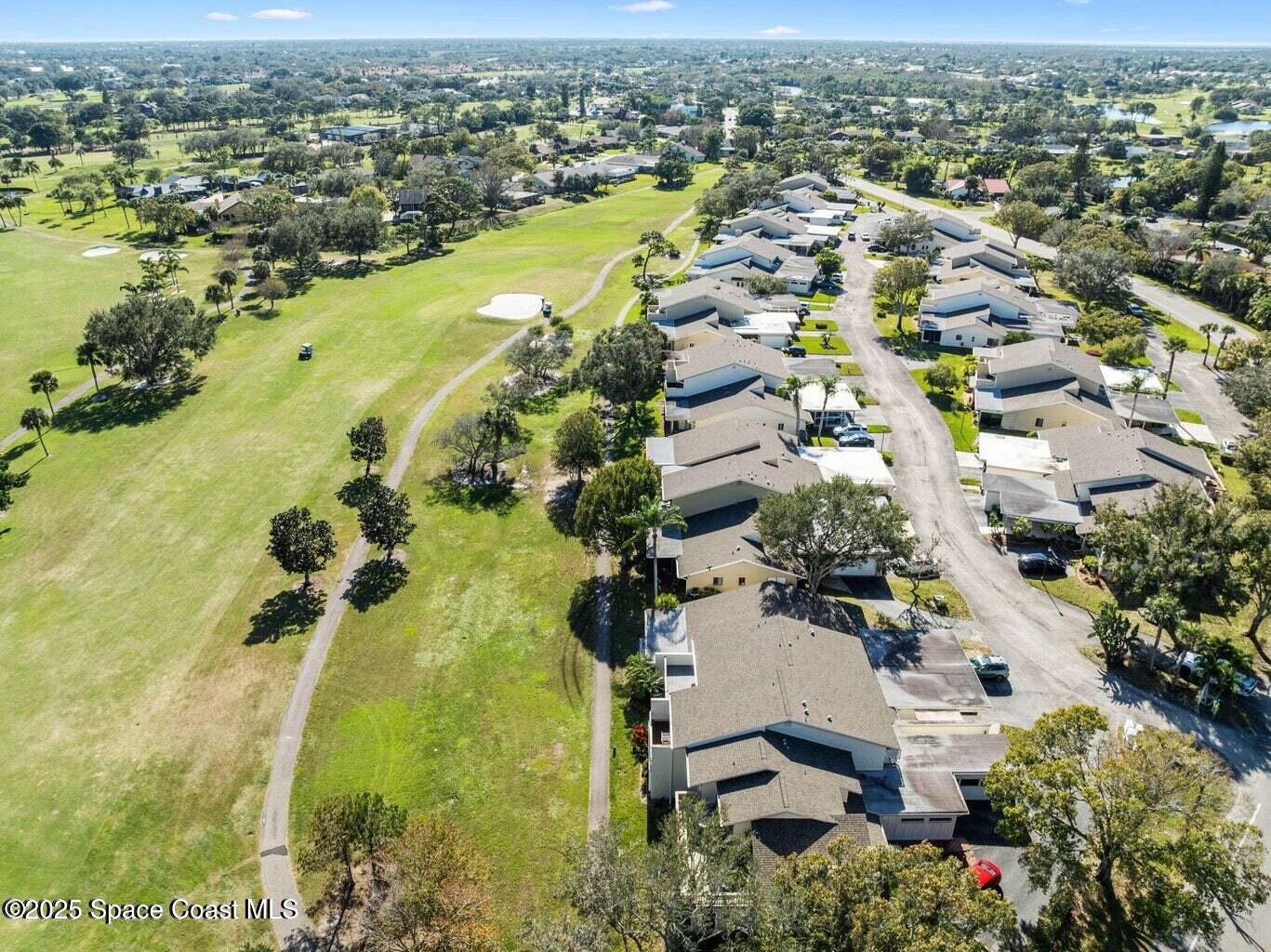 197 Augusta Way Melbourne, FL 32940 - Photo 32 of 37 an aerial view of residential houses with outdoor space