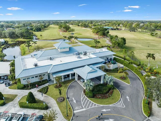 an aerial view of a house with outdoor space