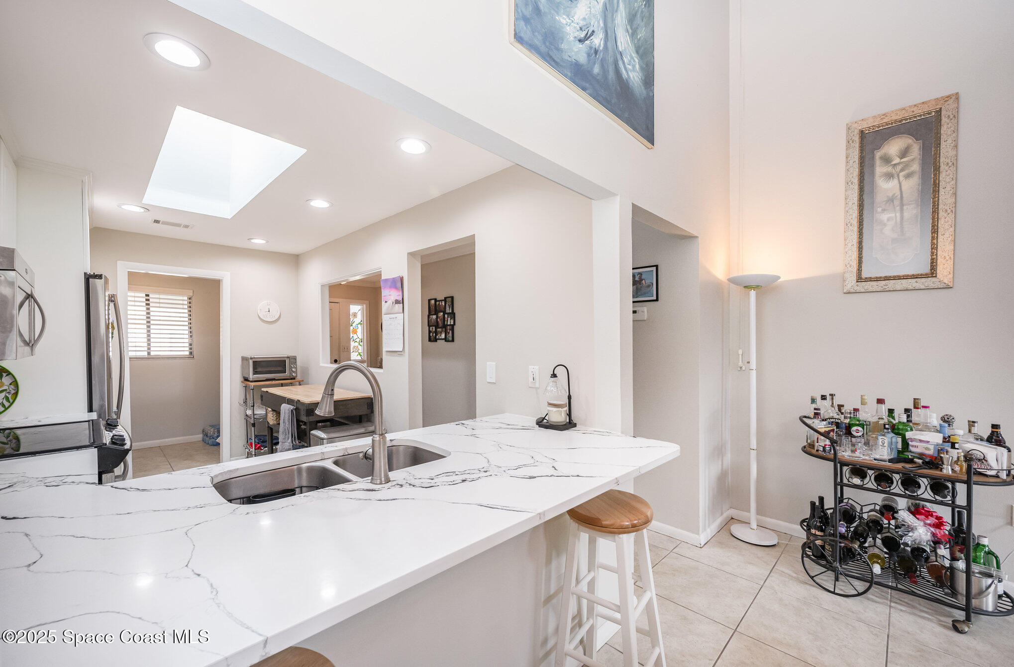 197 Augusta Way Melbourne, FL 32940 - Photo 4 of 37 a bathroom with a sink mirror and vanity