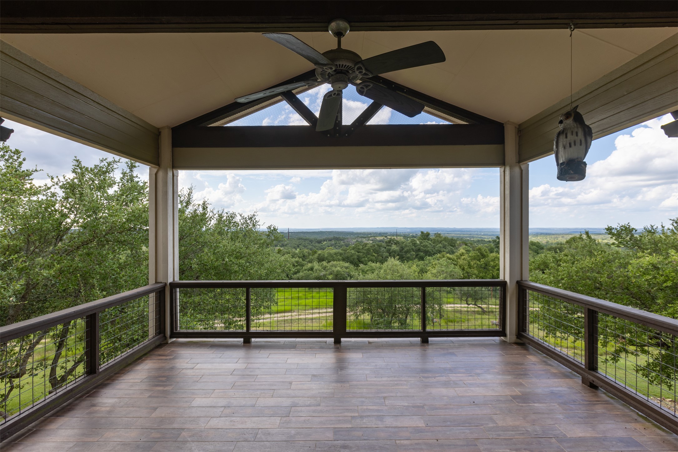 3149 Byrd Ranch Road Johnson City, TX 78636 - Photo 13 of 39 Wooden deck featuring ceiling fan and a wooded view