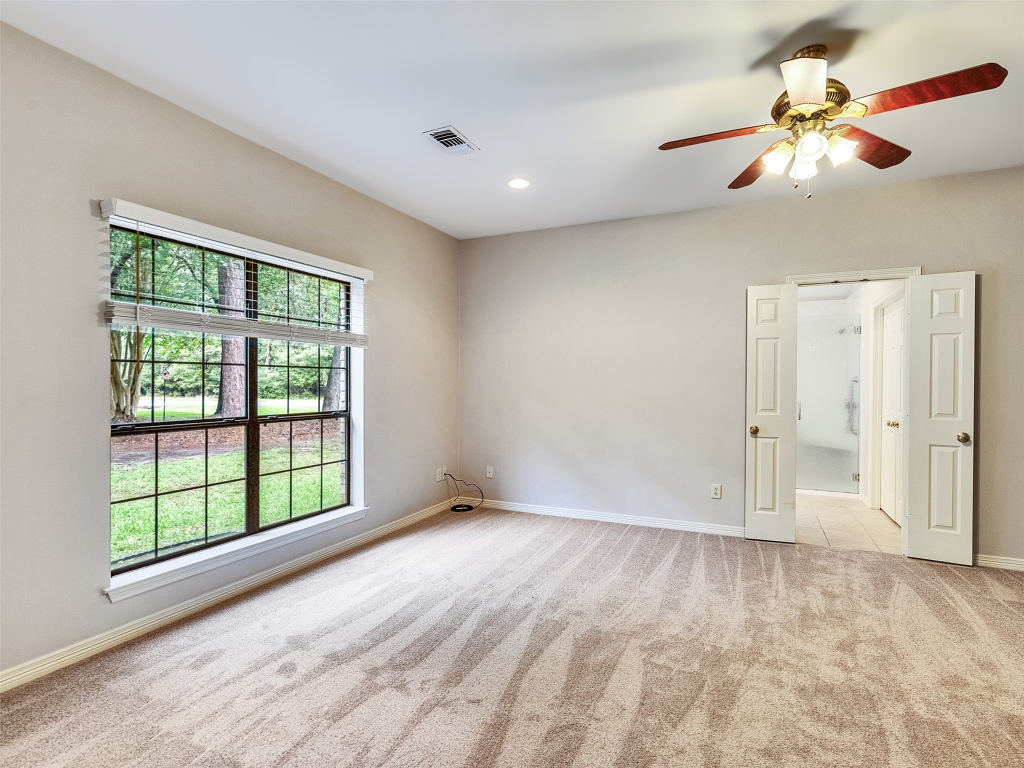 195 Coral Gables Trinity, TX 75862 - Photo 18 of 50 a view of an empty room with a window