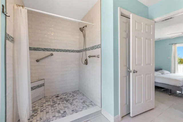 a bathroom with a sink a toilet and a window