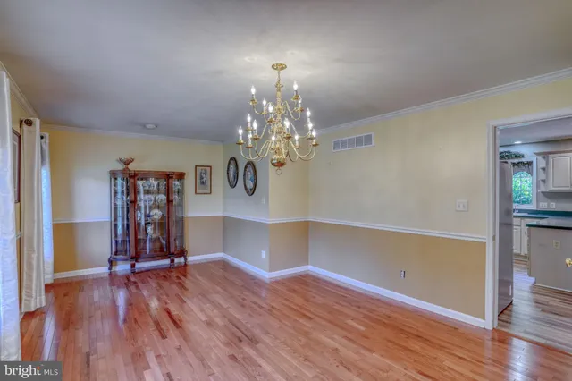 a view of livingroom with window wooden floor and door