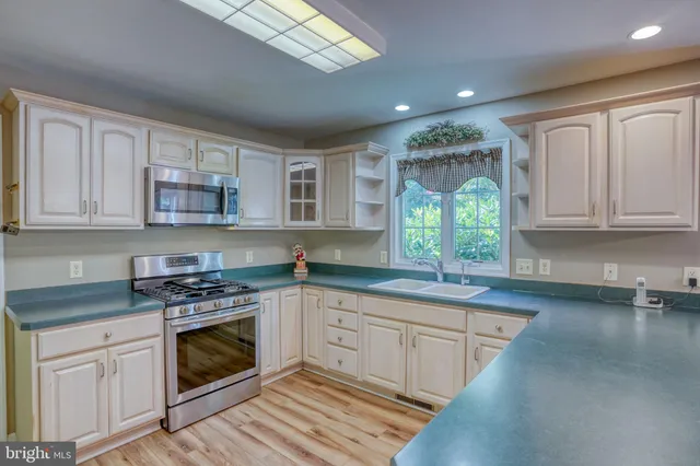 a kitchen with lots of counter top space and appliances