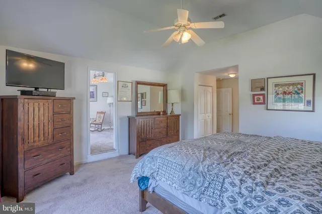 a view of room with workspace and wooden floor