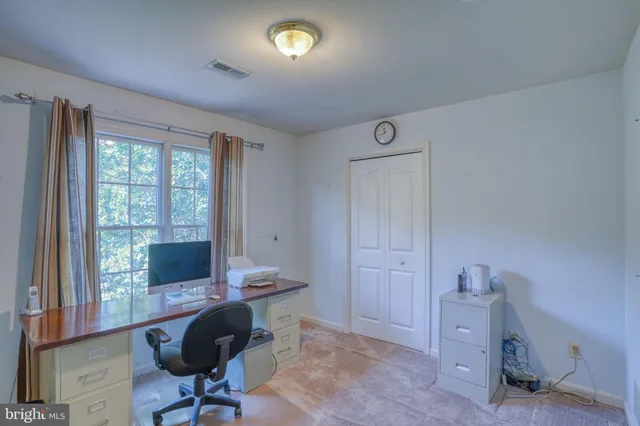 a workspace with furniture and a window