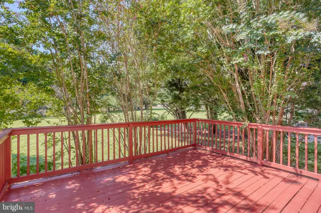 a view of a house with backyard and wooden floor